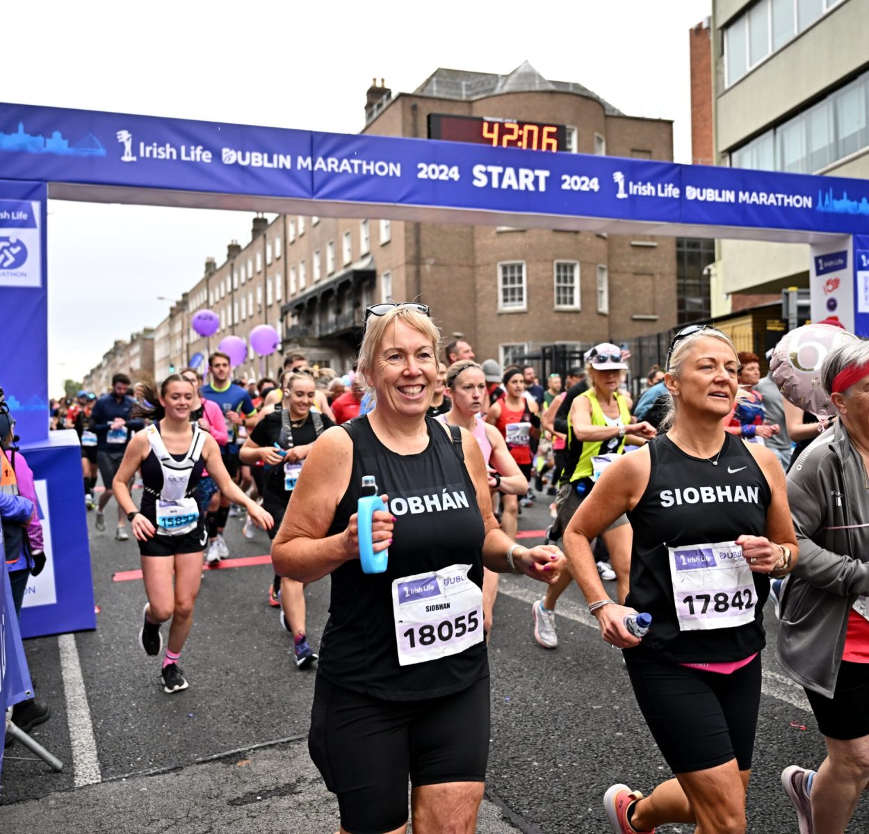 27 October 2024; Donnacha Brosnan, left, and Natasha Fleming during the 2024 Irish Life Dublin Marathon. This marks the 43rd edition of the race with thousands of participants from international athletes, club runners, wheelchair-assisted participants, charity runners, and first-time marathon participants taking on the 26.2-mile challenge. This years race started on Leeson Street and finished at the Pepper Canister Church on Mount Street Upper. Photo by Sam Barnes/Sportsfile *** NO REPRODUCTION FEE ***